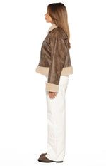 Side view of the cloud brown aviator jacket with faux fur collar and cuffs, showing its relaxed fit