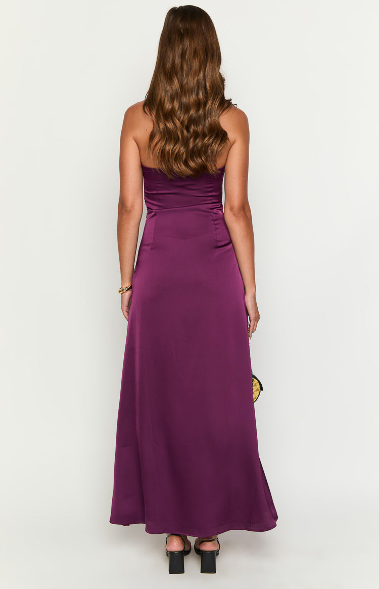 Back view of a deep purple strapless satin maxi dress showing the fitted waist and long flowing skirt