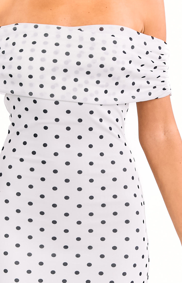 White polka dot off-shoulder maxi dress with a ruched neckline and short sleeve detail