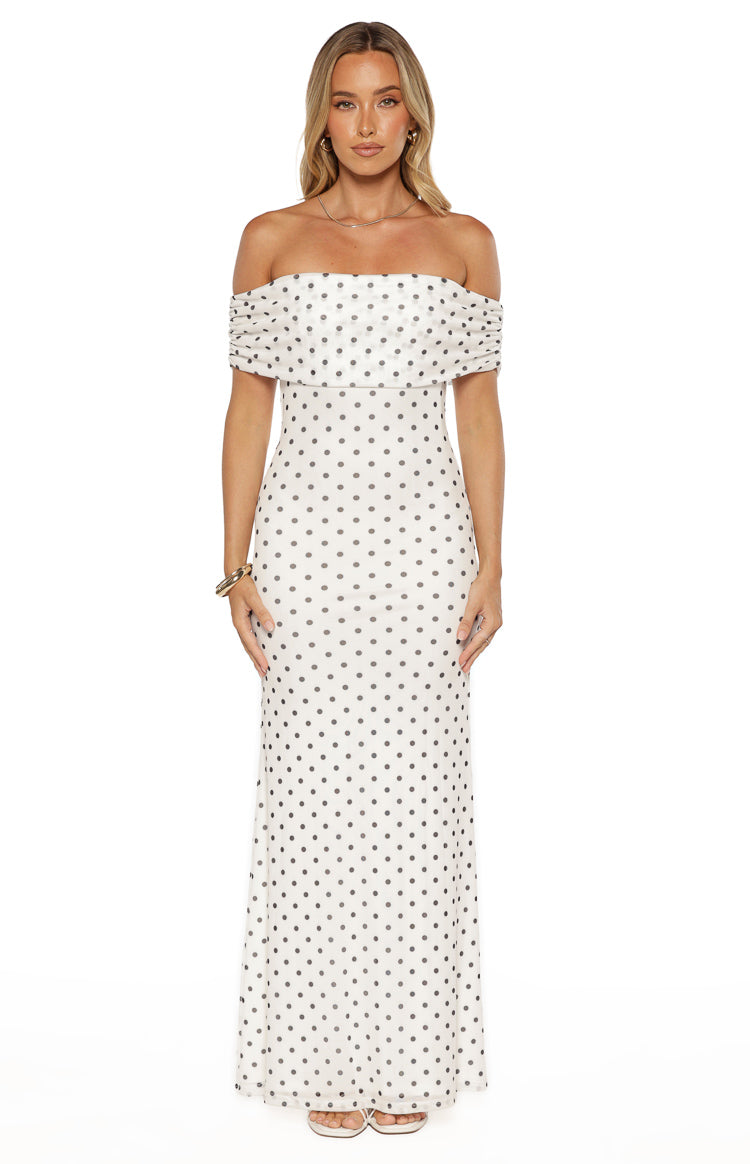 White polka dot mesh maxi dress with an off-shoulder ruffled neckline and a fitted bodice