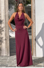 Rear view of a burgundy crepe maxi dress with a halter neck tie and open back, showing the zipper closure