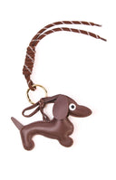 The Dachshund Braided Bag Charm in a chocolate brown colour a cute accessory to add personality to any handbag or purse.