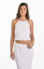 White textured halter top with gathered floral details and a cropped elasticated hem