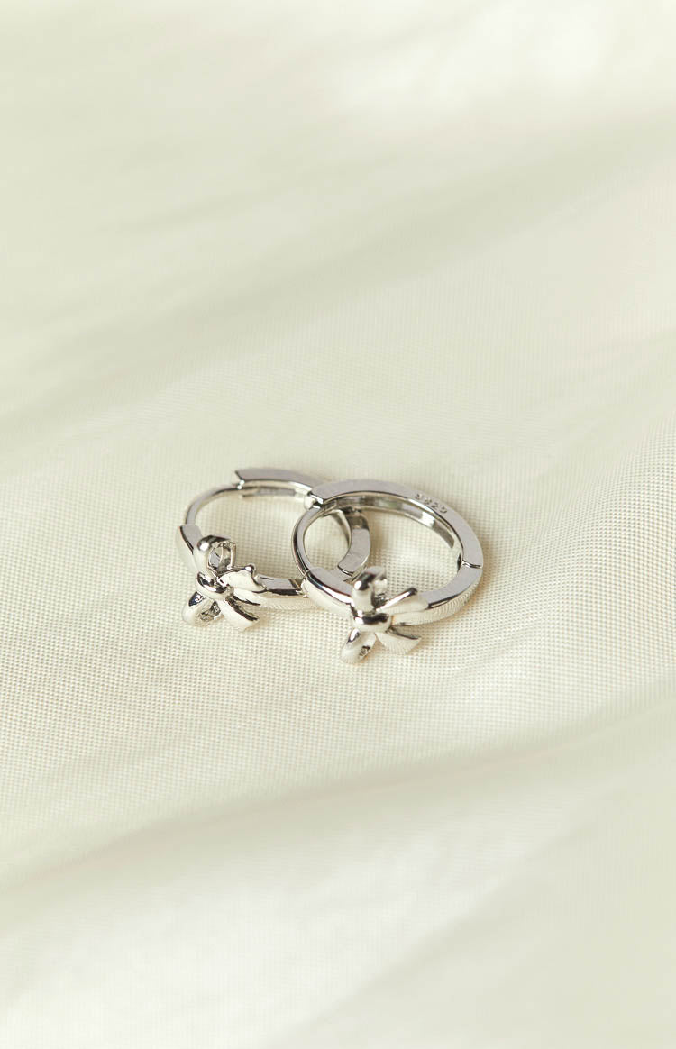 Darling Silver Bow Huggie Earrings (FREE over $90) Image