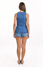 Rear view of a mid wash denim vest top with a high round neck and vertical back seam
