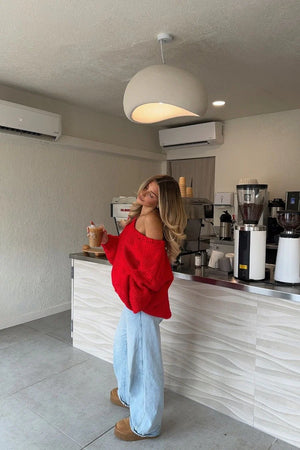 Beginning Boutique Delvey Red Chunky Knit Sweater red chunky knit oversized off-shoulder sweater with wide neckline