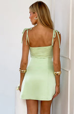 Rear view of a mint mini dress with lace bodice and tie-up spaghetti straps