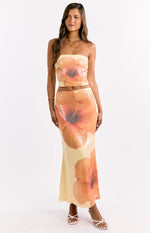 Yellow sequin maxi skirt with large orange hibiscus floral print and a fitted silhouette