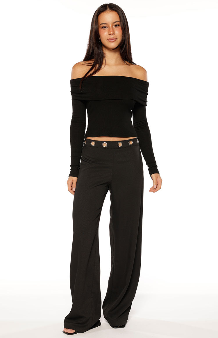 Black straight leg pants with a silver eyelet detail waistband and a relaxed fit