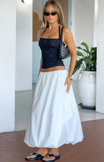 Side view of a white midi bubble hem skirt with a voluminous, relaxed fit