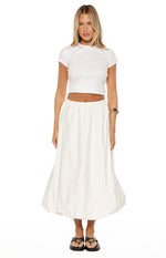 Front view of a white bubble hem midi skirt with an elasticated waist and voluminous fabric