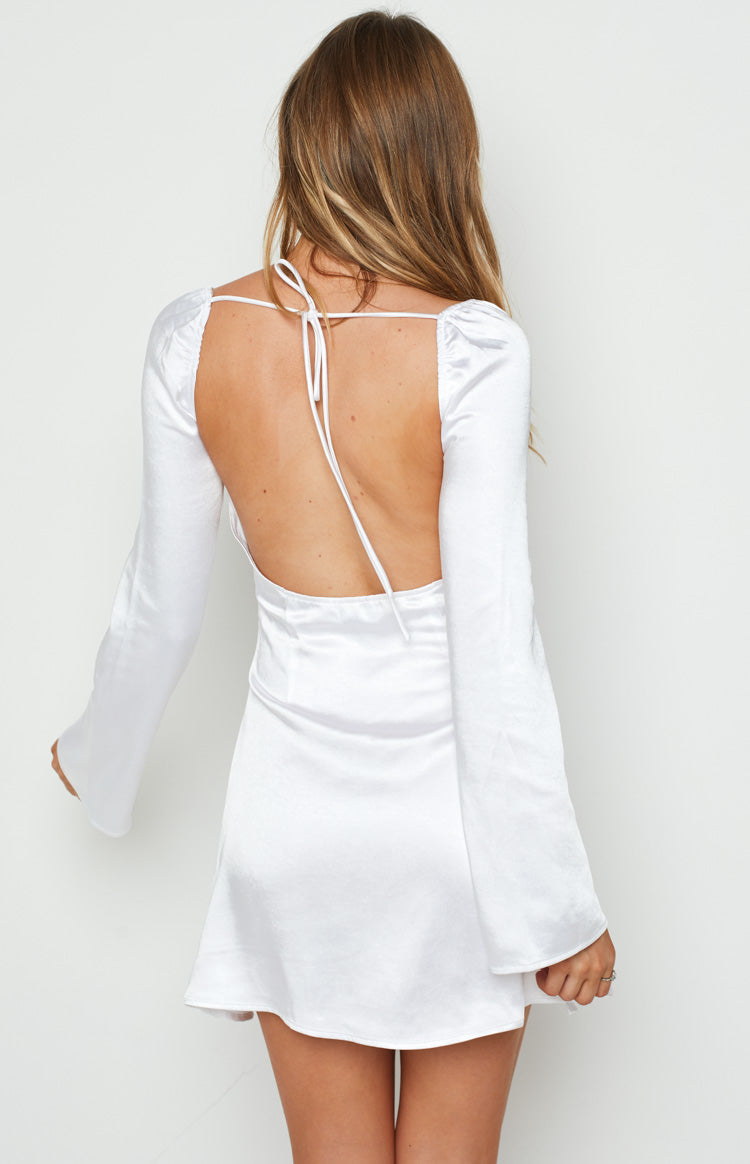 Rear view of a white satin mini dress with a low scoop back, tie-up straps, and long bell sleeves
