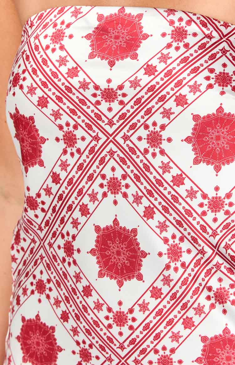 Close-up of the red and white tile print mini dress fabric, showing intricate mandala and geometric patterns