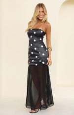 Black strapless maxi dress with white polka dot fitted bodice and sheer flowy maxi skirt