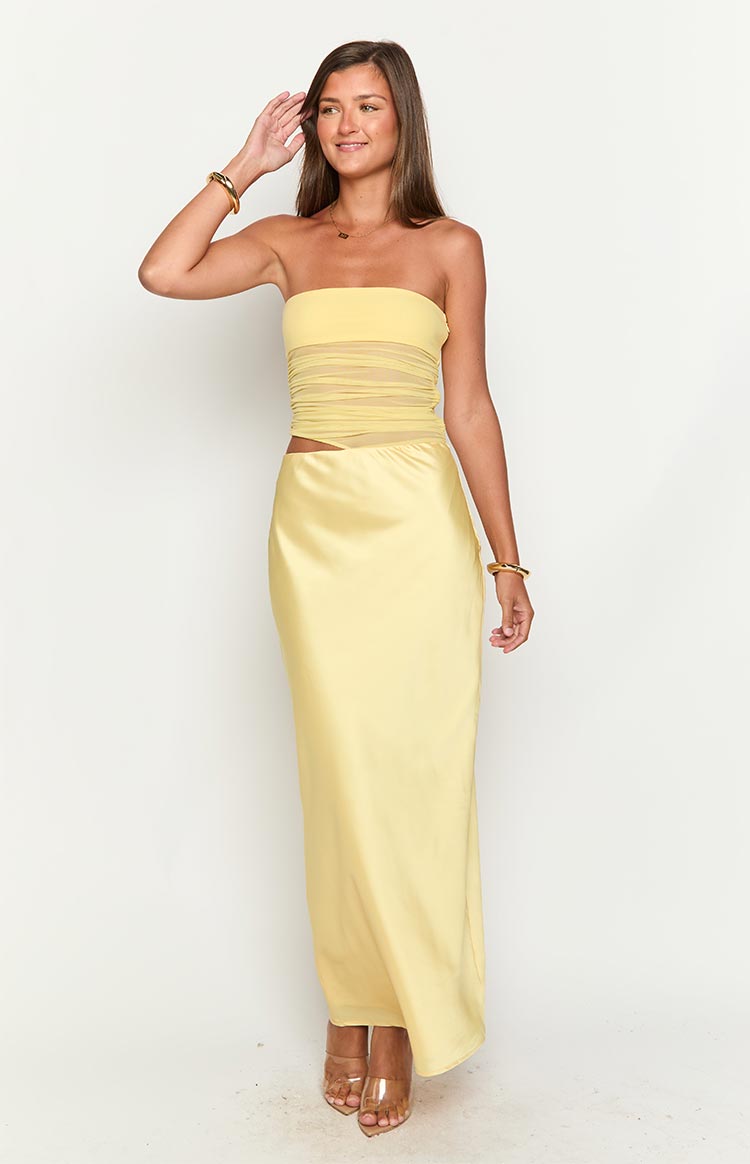 Yellow strapless maxi dress with a ruched mesh midriff panel and a side waist cutout