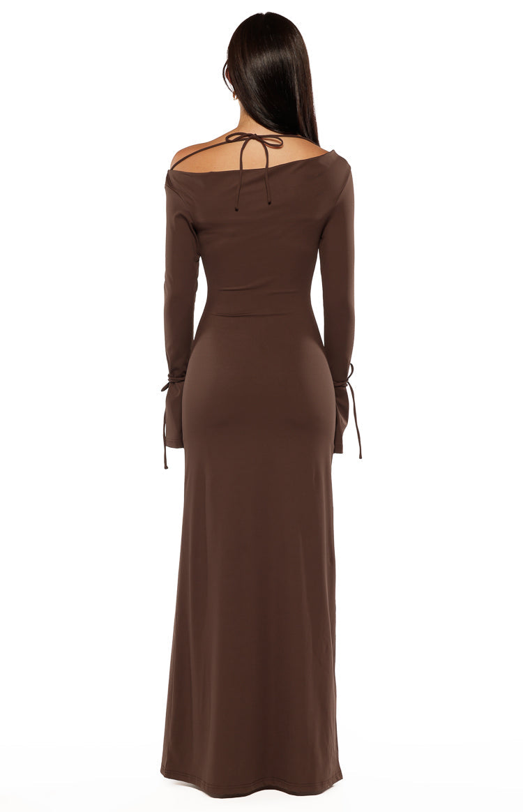 Rear view of a chocolate jersey maxi dress with an off-shoulder tie-back neckline and tie details on the long sleeves