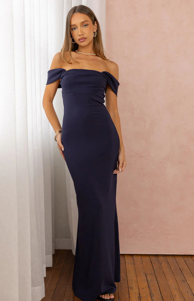 Navy crepe off-shoulder maxi dress with a fitted bodice and flowing skirt