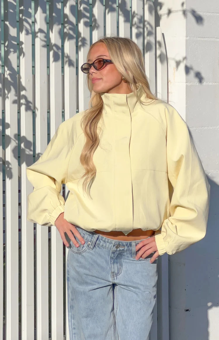 Beginning Boutique Enya Yellow Funnel Neck Sports Jacket pale yellow funnel neck sports jacket with raglan sleeves, elasticat