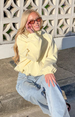 Light yellow funnel neck sports jacket with a relaxed fit and elasticated cuffs and hem