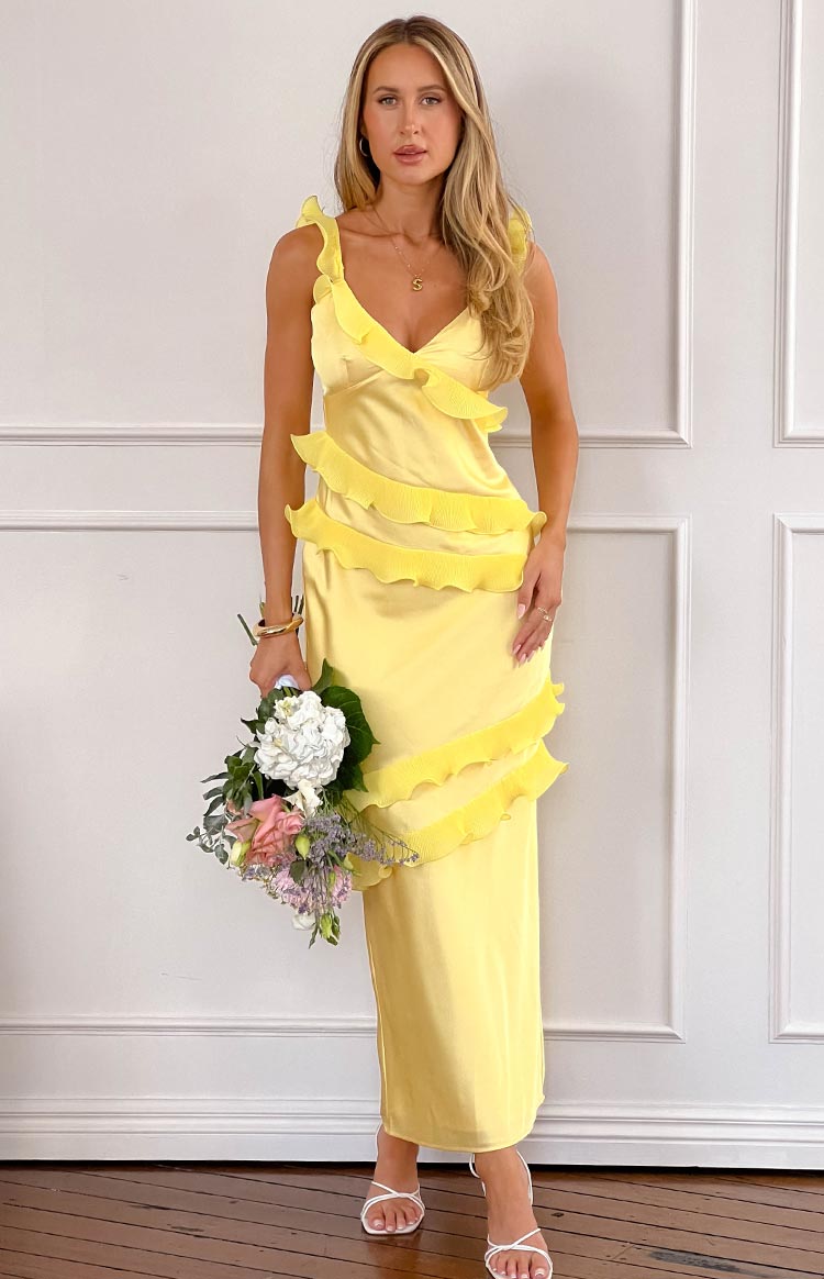 Beginning Boutique Evan Yellow Maxi Dress yellow satin V-neck maxi dress with ruffled straps and diagonal tiered ruffles