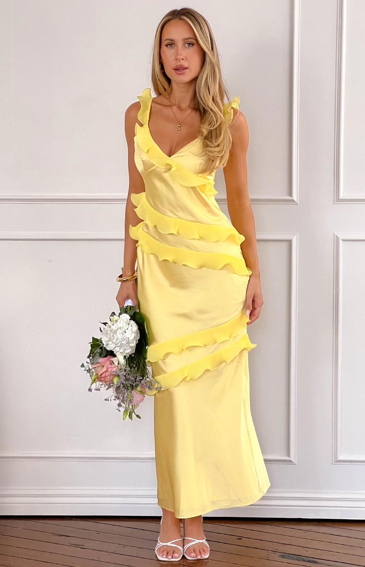 Full length yellow satin maxi dress with a V-neck, ruffled shoulder straps, and tiered ruffle details