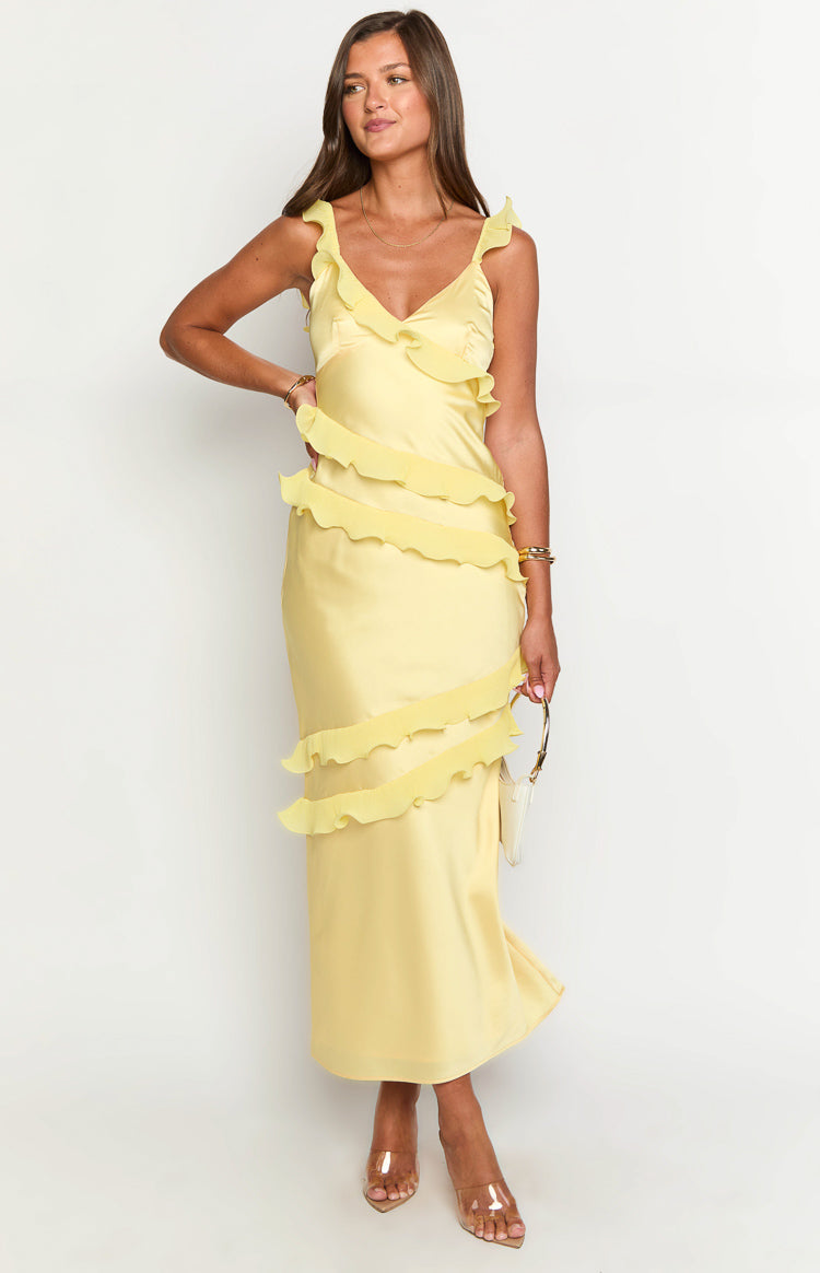 Front view of a yellow satin maxi dress with a V-neck, ruffled shoulder straps, and tiered ruffles cascading down the front