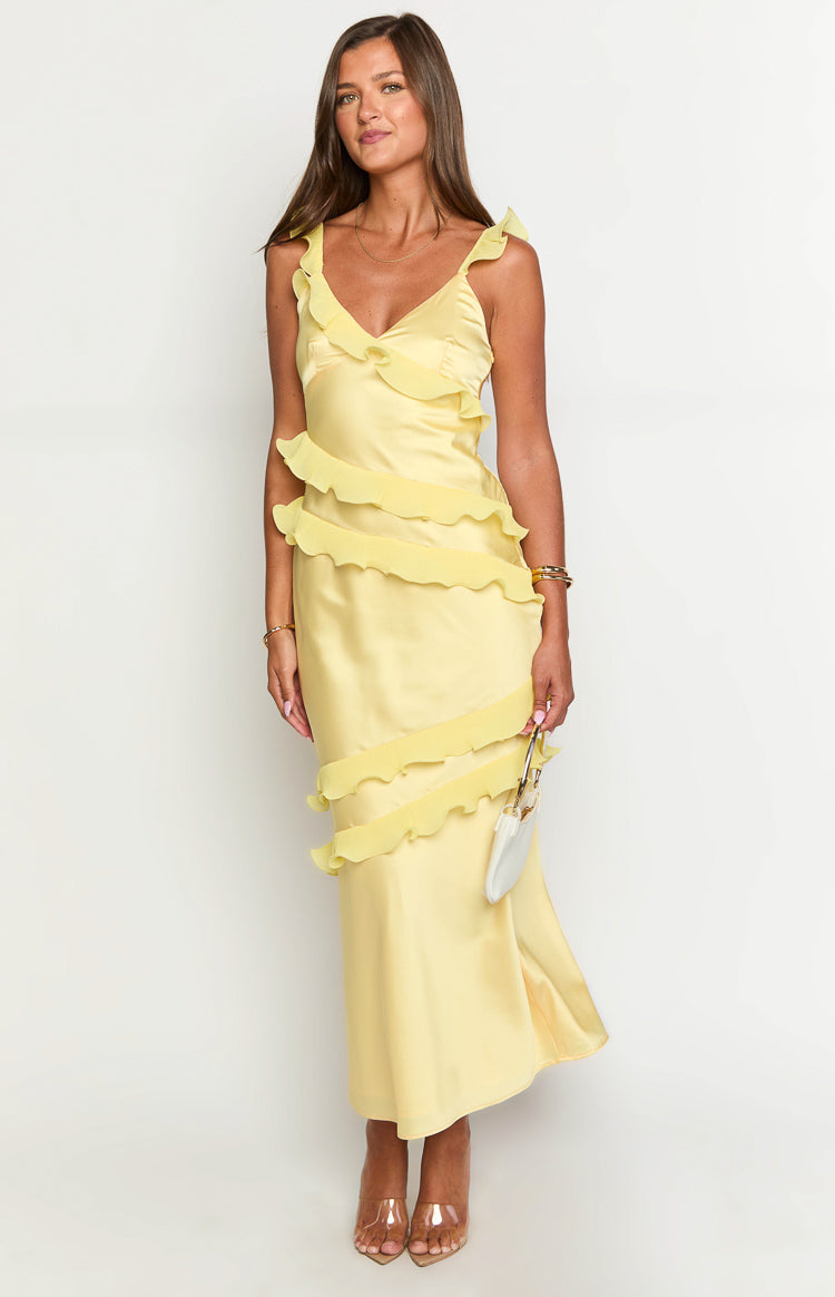 Full length view of a yellow satin maxi dress with tiered ruffles across the bodice and skirt, V-neckline and ruffled straps