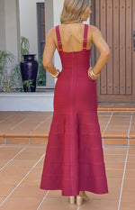Back view of a burgundy bandage maxi dress showing the square back, thick straps, and exposed zipper