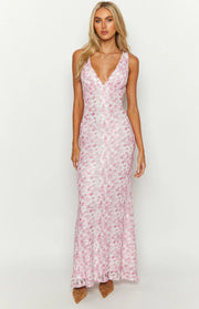 Pink floral lace maxi dress with a deep V-neckline and a fitted silhouette, flowing slightly at the hem