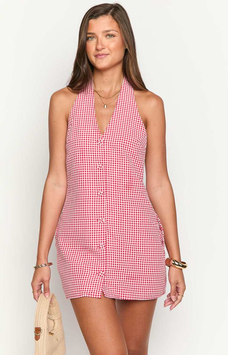 Front view of a red and white gingham halter mini dress with a deep V-neck and full button-front