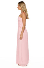 Side view of a pink maxi dress showing ruched bodice detail and side waist ties