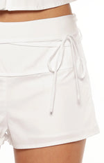 Front view of white fitted high-waisted mini shorts in a smooth cotton blend fabric for casual wear