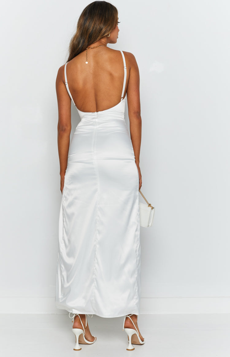 White satin maxi dress with a low scoop back, thin adjustable straps, and a flowing skirt
