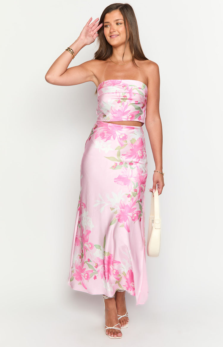 Front view of a pink floral print strapless cropped bandeau top