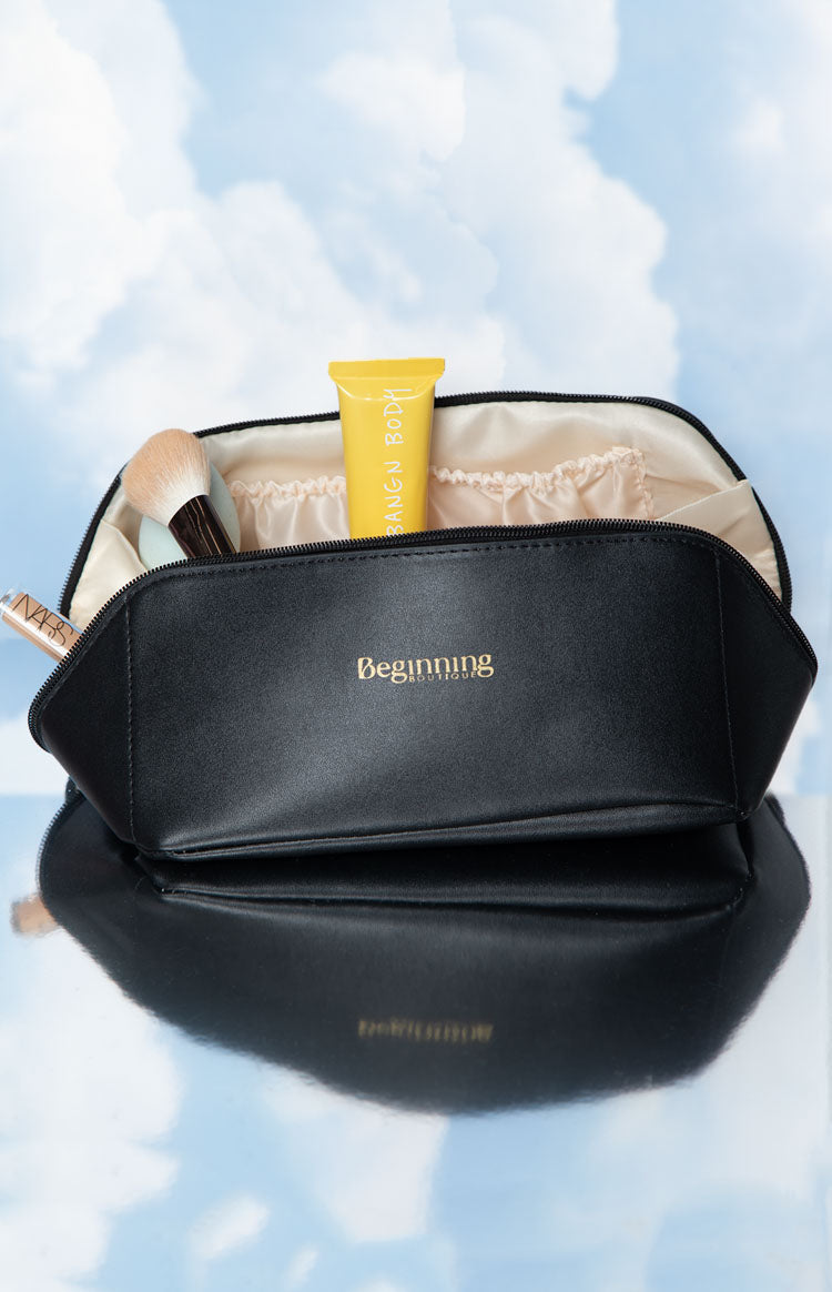 Beginning Boutique Black Zipper Cosmetic Bag black faux leather cosmetic bag with gold logo and light interior with elastic pockets