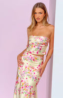 Fitted yellow strapless crop top with a vibrant pink and orange floral print