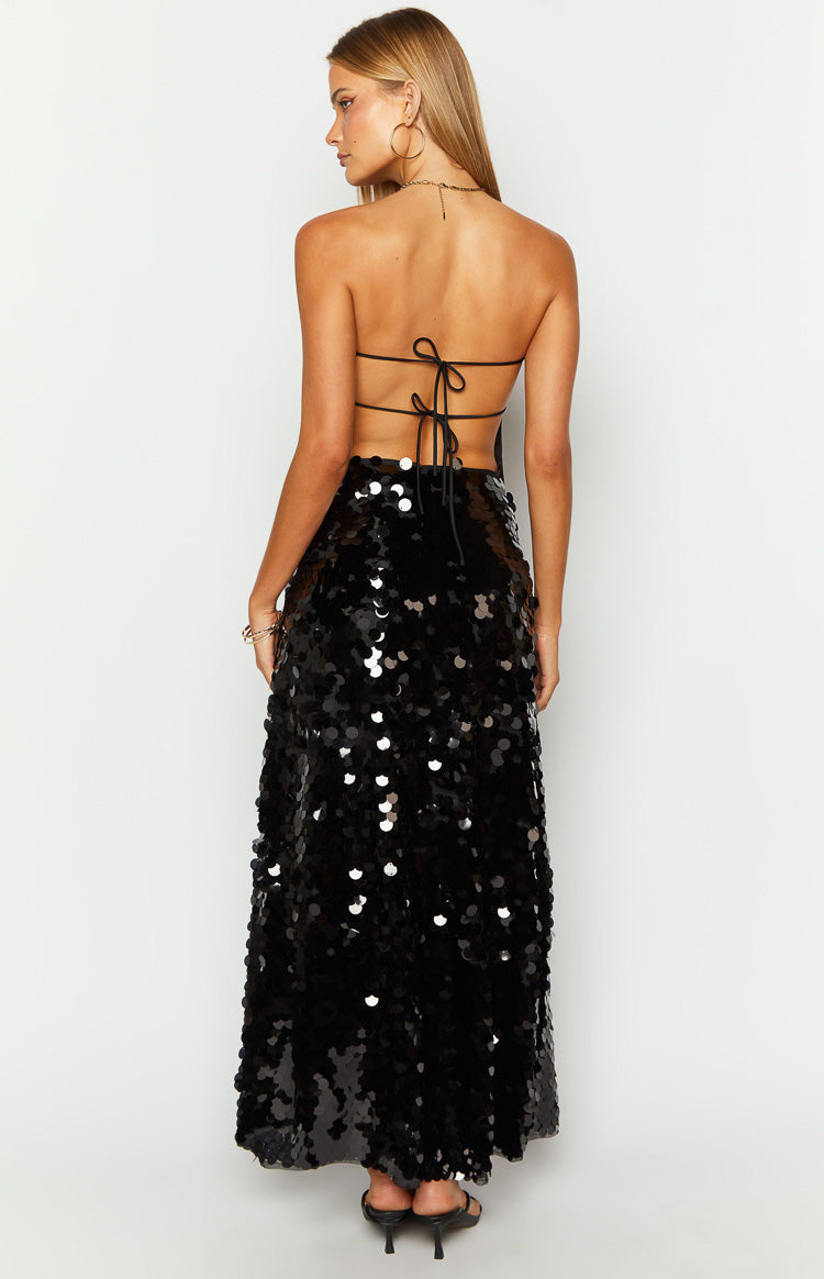 Rear view of a black sequin maxi skirt with a flowy silhouette