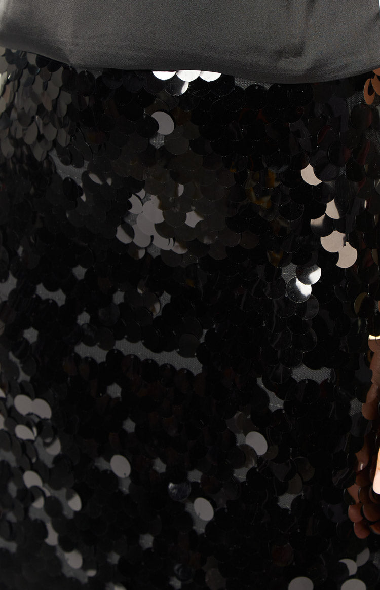 Black sequin maxi skirt with a straight silhouette and all-over shimmering disc sequins