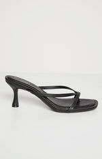 Side view of black kitten heels featuring a slender flared kitten heel and square toe