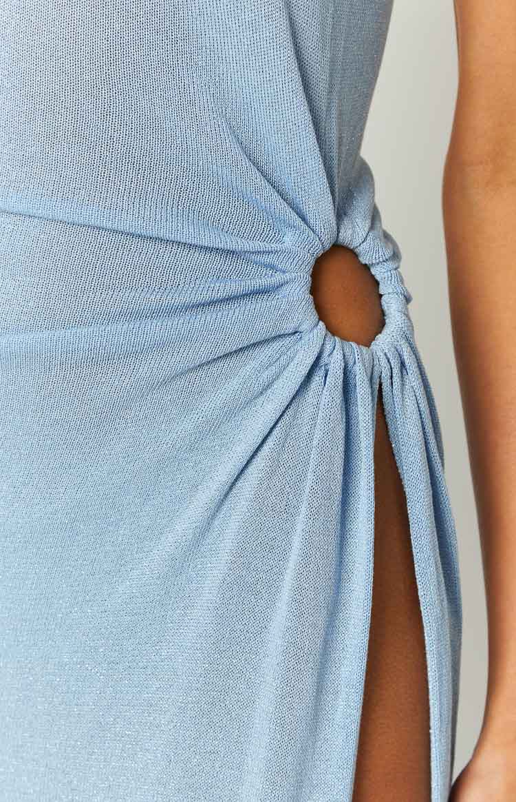 Detail shot of the blue shimmery knit midi dress with a side O-ring and high thigh slit
