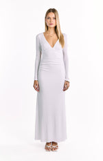 Front view of a white long sleeve maxi dress with a deep V-neckline and ruched bust and waist