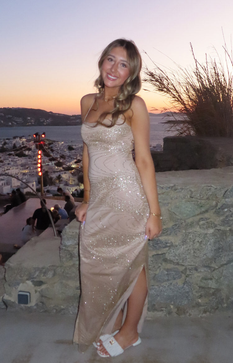 Gold bodycon slip formal dress with spaghetti straps, straight neckline, side split, and wavy glitter pattern