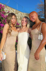 Cream strapless mesh maxi dress with a ruffled bust line and side ruched drape detail