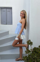 Beginning Boutique Klee Light Blue Strapless Tie Back Top light blue and white striped strapless top with a fitted bodice and
