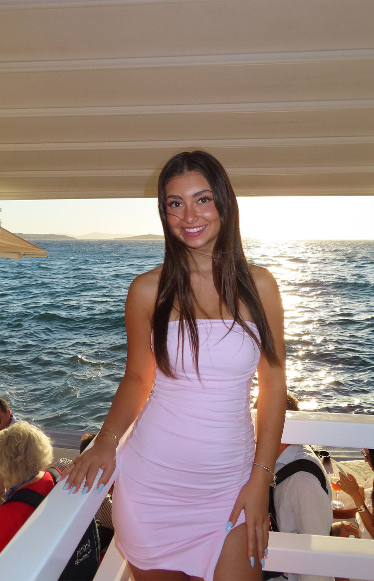 Beginning Boutique Let Go Baby Pink Ruched Mini Dress baby pink strapless bodycon mini dress with side ruching and a thigh sl