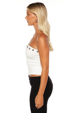 Side view of a white strapless tube top with eyelet details along the top edge