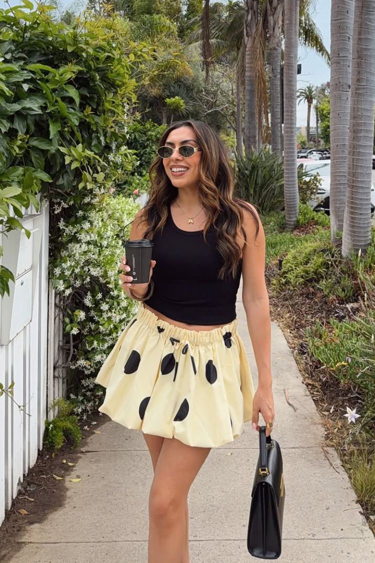 Beginning Boutique Henrietta Yellow Polka Dot Bubble Hem Mini Skirt light yellow black polka dot bubble hem mini skirt with a