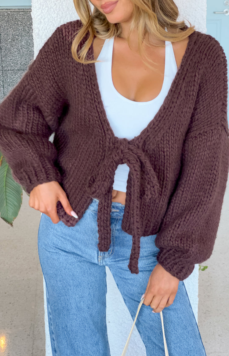 Close-up of the chocolate brown chunky knit cardigan with a front tie closure and V-neckline