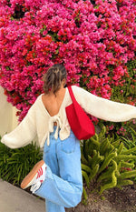 Beginning Boutique Holiday Cream Tie Up Knit Cardigan cream chunky knit cropped cardigan with deep V-back and tie detail