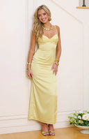 Fitted honey yellow satin maxi dress with a draped cowl neckline and a high ruched side slit